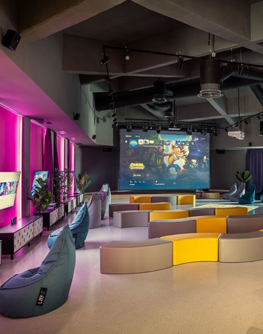 Cozy lounge space with projector at Ketti Heights – one of the best resorts in Ooty for business and leisure